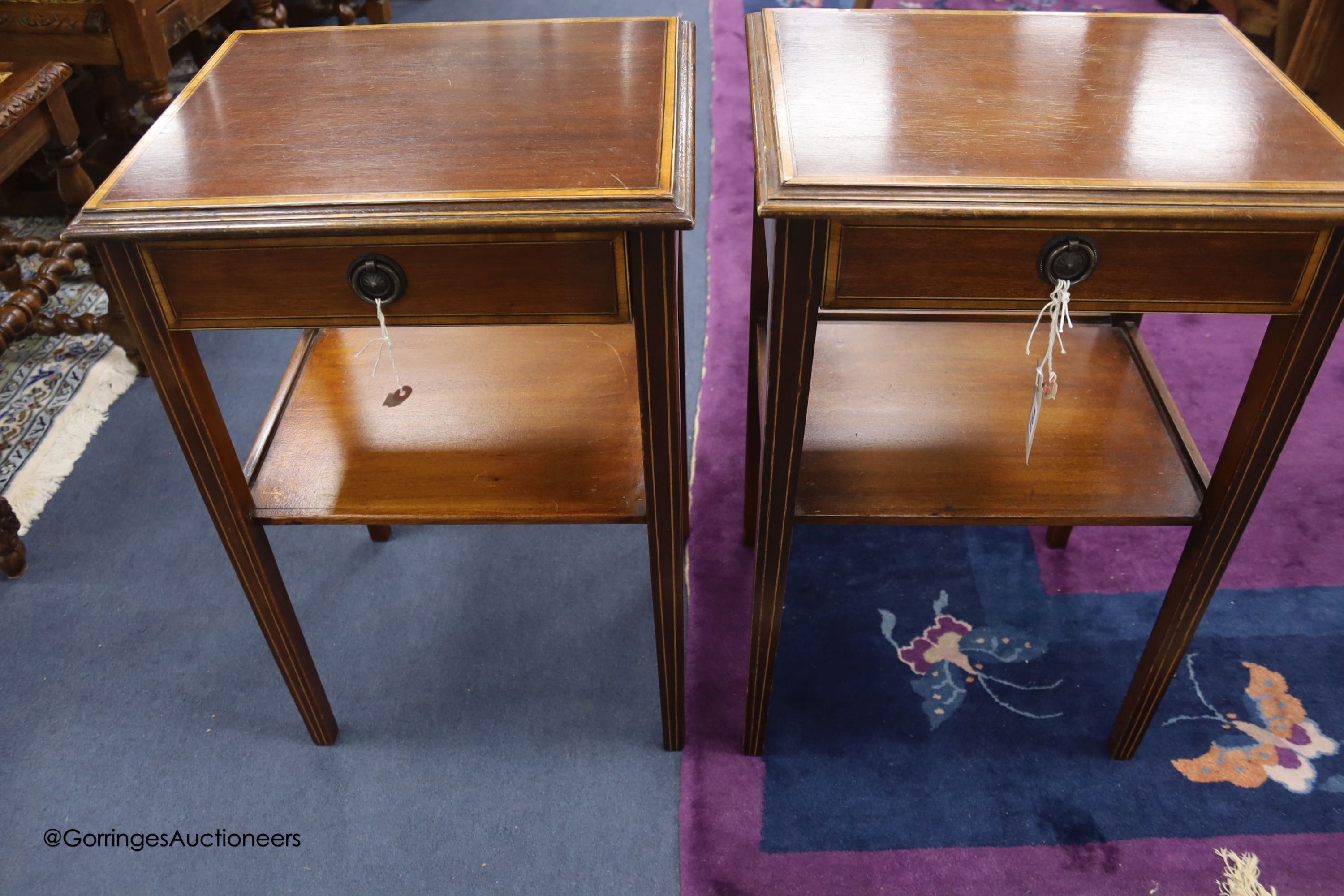A pair of satinwood banded mahogany two tier tables, from Officer's Mess RAF Biggin Hill, sold by the Ministry of Defence, Feb 1994, width 41cm depth 33cm height 61cm